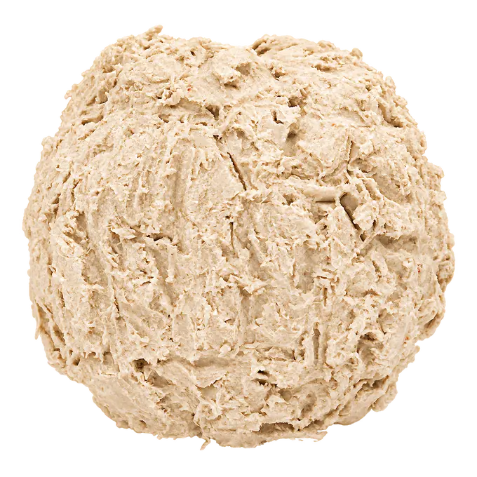 Heavy wear on a D-Bone Ball dog chew: flakes cover the whole surface and the moulded facets are gone.