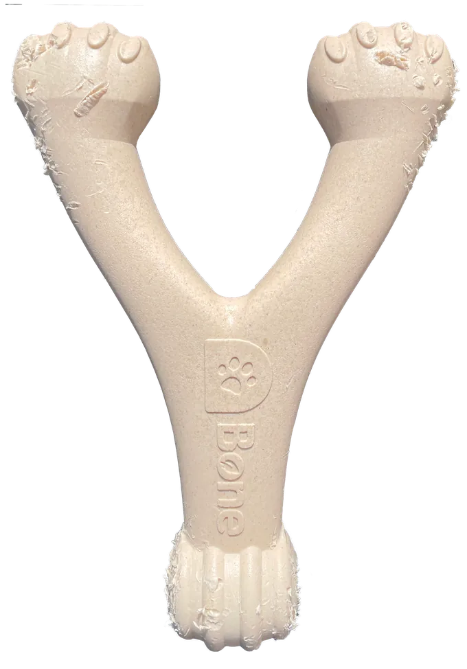 Light wear on a D-Bone Wishbone dog chew after regular chewing: the surface is roughened with small flakes at the ends.